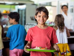 school-boy-holding-food-tray